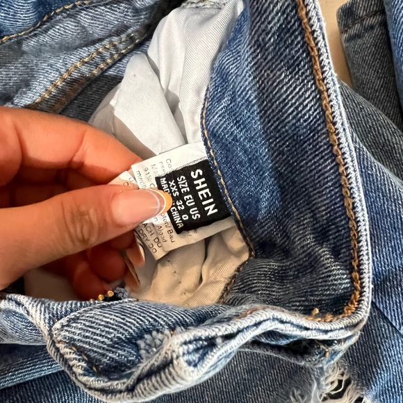 Ripped jeans. - Picture 2 of 3